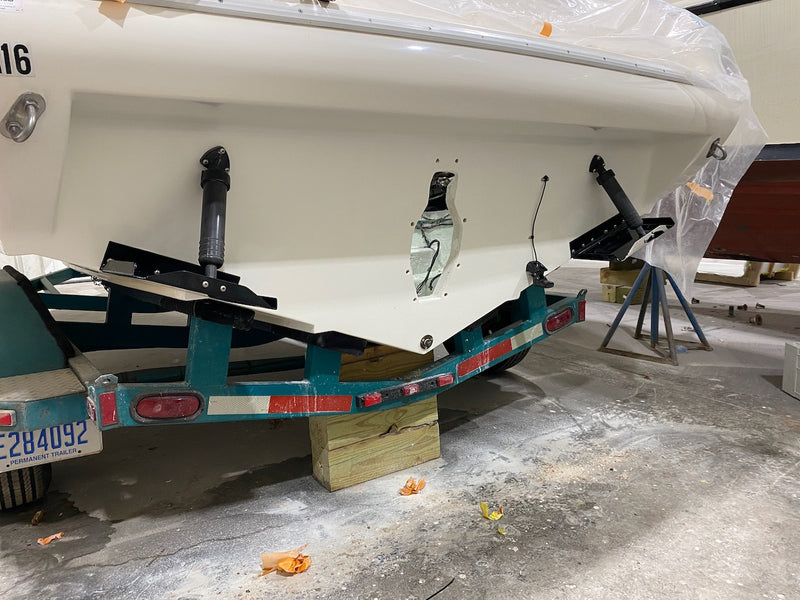 Boat transom on a trailer with the engine bracket removed during repair