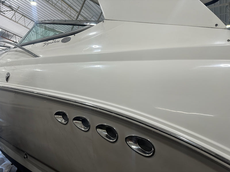 Finished hull-side repair with a polished gloss finish and four portholes