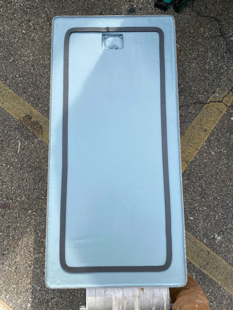 White fiberglass panel with two dark stripes after repair