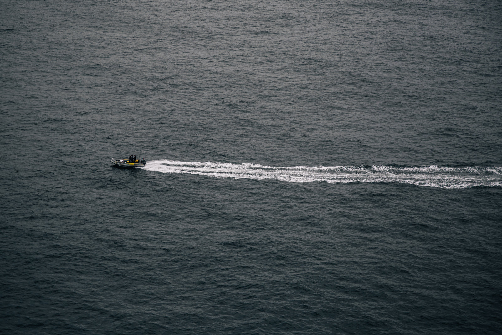 a safety dinghy patrols waters