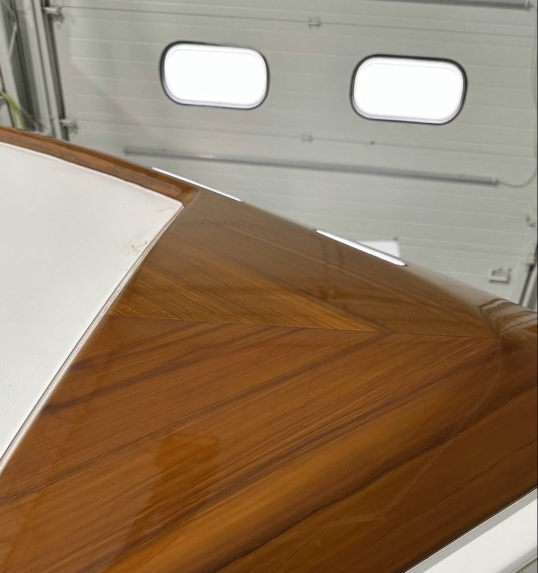 Close-up of Poiema's faux teak toe rail